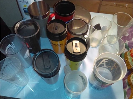 various cups - plastic and glass, some with lids