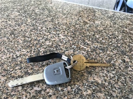 Found: Honda key w/ P.O. Box key (Queen K Hwy by airport) 